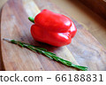 Fresh rosemary and sweet red bell pepper on a wooden background. The concept of a delicious and healthy diet. 66188831