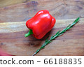 Fresh rosemary and sweet red bell pepper on a wooden background. The concept of a delicious and healthy diet. 66188835