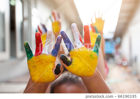 Cute asian child boy and girl with painted hands 66190195