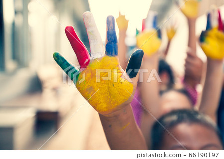 Children hands in colorful painted 66190197