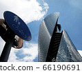Traffic sign and tower building 66190691