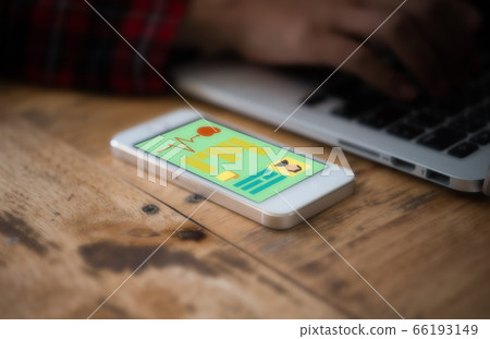 Hands of a woman working on laptop with smartphone Hands of a woman working on laptop with smartphone 66193149