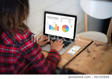 Close-up rear view of young business woman working Close-up rear view of young business woman working 66193666