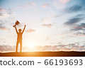 Silhouettes of man won a trophy, achieved with his 66193693
