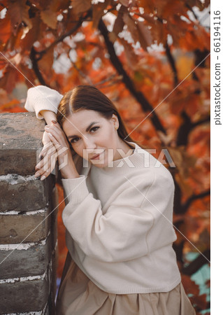 stylish girl visiting the Great Wall of China near Beijing during autumn 66194116