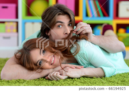 Portrait of beautiful young couple at home 66194925