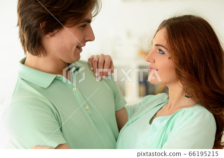 Portrait of beautiful young couple at home Portrait of beautiful young couple at home 66195215