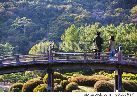 Couple standing on the bridge Couple standing on the bridge 66195687