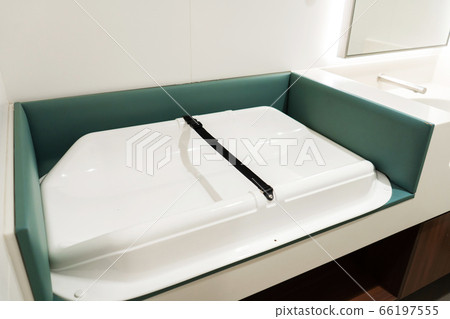 A table for changing a baby in a women's restroom. A table for changing a baby in a women's restroom. 66197555