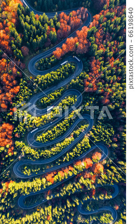 Winding road in Carpathian Mountains, Romania Winding road in Carpathian Mountains, Romania 66198640