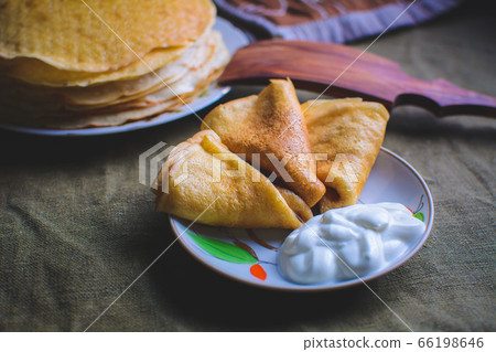 traditional pancakes, homemade pastries with sour cream traditional pancakes, homemade pastries with sour cream 66198646