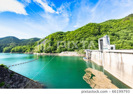 Kurikoma Dam in spring and emerald green Lake Kurikoma 66199793