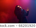A jazz singer performs on stage. Afro. 66201920
