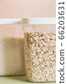 Plastic containers with cereals. Home storage products. Rice and oat. 66203631