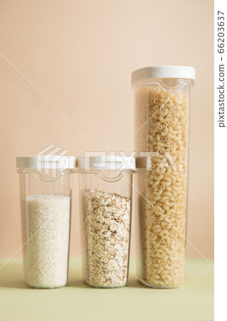 Plastic containers with cereals. Home storage products. Rice, oat and pasta. Plastic containers with cereals. Home storage products. Rice, oat and pasta. 66203637