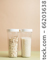 Plastic containers with cereals. Home storage products. Rice and oat. 66203638