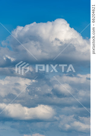 Natural sky composition. Sunny vast blue sky abstract background. Beautiful cloudscape, view over white fluffy clouds. Freedom concept, on the heaven. Element of design. 66204621