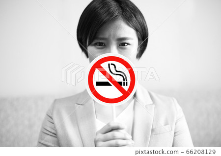 Smoking image of a woman in a suit Smoking image of a woman in a suit 66208129