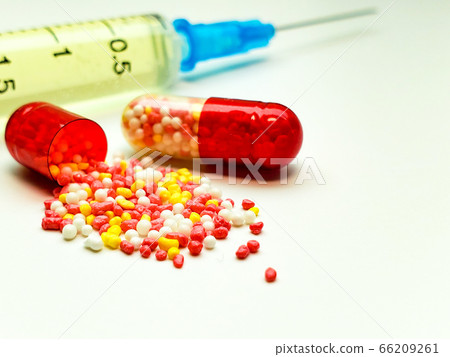 open the capsule and syringe closeup on white background, syringe raspakuje open the capsule and syringe closeup on white background, syringe raspakuje 66209261