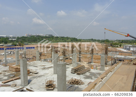 KUALA LUMPUR, MALAYSIA -MARCH 5, 2020:The construction site is operating during the day. Workers are busy carrying out their activities as planned under the supervisor's supervision. KUALA LUMPUR, MALAYSIA -MARCH 5, 2020:The construction site is operating during the day. Workers are busy carrying out their activities as planned under the supervisor's supervision. 66209836