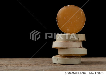 Stack of jaggery on wooden table with copy space. Organic sugar made from palm or coconut. Stack of jaggery on wooden table with copy space. Organic sugar made from palm or coconut. 66212878