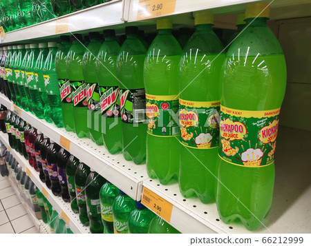 KUALA LUMPUR, MALAYSIA -MAY 17, 2020: Soft drinks or carbonated drinks arranged and stacked on the rack inside the huge supermarket for sale. Sorted by the brand to make easy for the customer to buy KUALA LUMPUR, MALAYSIA -MAY 17, 2020: Soft drinks or carbonated drinks arranged and stacked on the rack inside the huge supermarket for sale. Sorted by the brand to make easy for the customer to buy 66212999