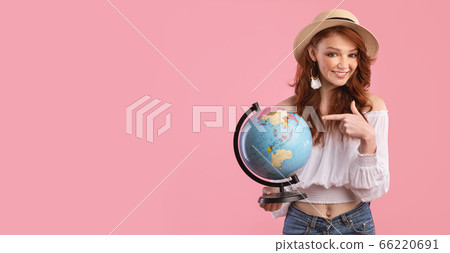 Smiling Girl Holding Globe Posing In Studio Over Pink Background Smiling Girl Holding Globe Posing In Studio Over Pink Background 66220691
