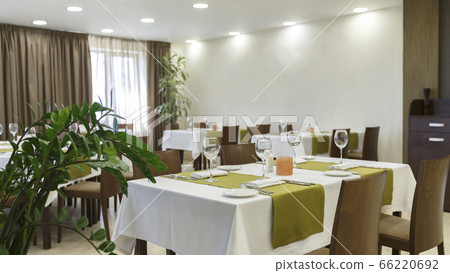 Interior of empty restaurant with green plants Interior of empty restaurant with green plants 66220692