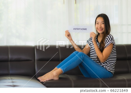 asian business woman work from home with laptop mobile phone with cardboard box ready for shipping asian business woman work from home with laptop mobile phone with cardboard box ready for shipping 66221849