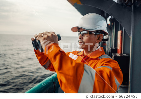 Filipino deck Officer on deck of vessel or ship , wearing PPE personal protective equipment Filipino deck Officer on deck of vessel or ship , wearing PPE personal protective equipment 66224453