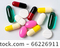 Assorted pills multicolored isolated. 66226911