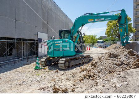 Excavator car at road construction site with blue sky Excavator car at road construction site with blue sky 66229807