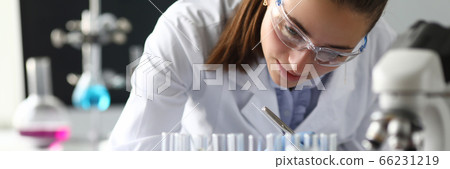 Modern experiments with chemicals in laboratory. 66231219