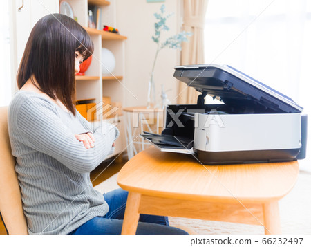 Woman opening the printer trouble trouble ink exchange copy space 4:3 66232497