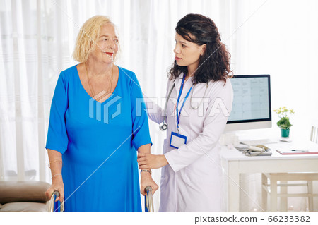 Physician helping senior woman 66233382