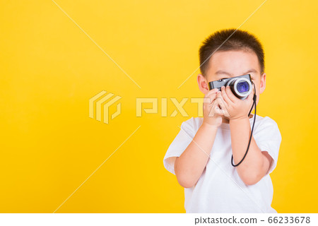 child boy hold photo camera compact doing taking child boy hold photo camera compact doing taking 66233678