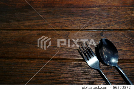 Vintage silverware spoon and fork on rustic wooden 66233872