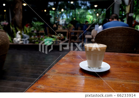 Cup of coffee on table in cafe - vintage style Cup of coffee on table in cafe - vintage style 66233914