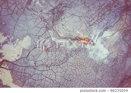 Drought Top View. Aerial view of a cracks in the ground. texture. Desert landscape. Drought Top View. Aerial view of a cracks in the ground. texture. Desert landscape. 66235054