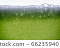 Background of close-up soda bubbles mixed with lemon juice or green juice on white background. 66235940