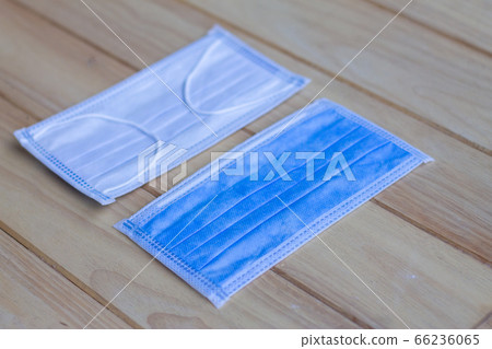 Two pieces of blue Sanitary mask on wooden Two pieces of blue Sanitary mask on wooden 66236065