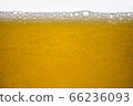 Background of close-up soda bubbles mixed with yellow fruit juice on white background. 66236093