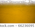 Background of close-up soda bubbles mixed with yellow fruit juice on white background. 66236095
