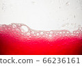 Background of close-up soda bubbles mixed with red fruit juice on white background. 66236161