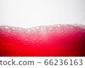 Background of close-up soda bubbles mixed with red fruit juice on white background. 66236163