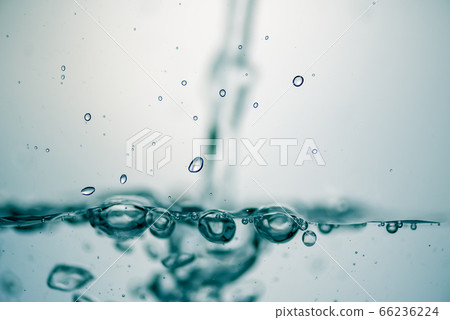 Background of pure water is pouring with bubbles. Background of pure water is pouring with bubbles. 66236224