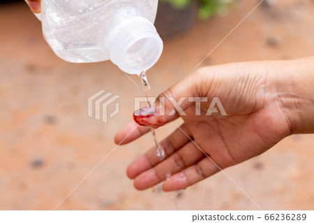The saline solution is poured over the human 66236289
