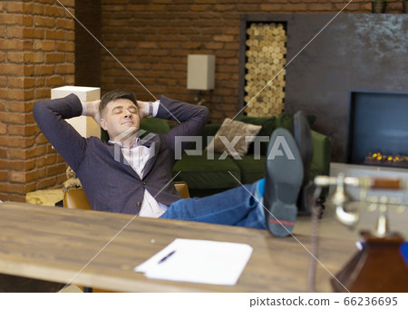 Happy businessman having rest after successful negotiations and contracting. 66236695