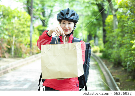 Female deliveryman delivery 66236922