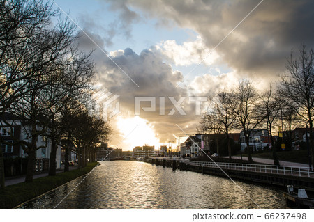 Cityscape of Delft in the Netherlands Sunset over the canal Cityscape of Delft in the Netherlands Sunset over the canal 66237498